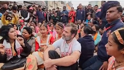 <div class="paragraphs"><p>Rahul Gandhi and other Congress leaders staging a sit-in outside the Batadrava Than holy shrine.</p></div>