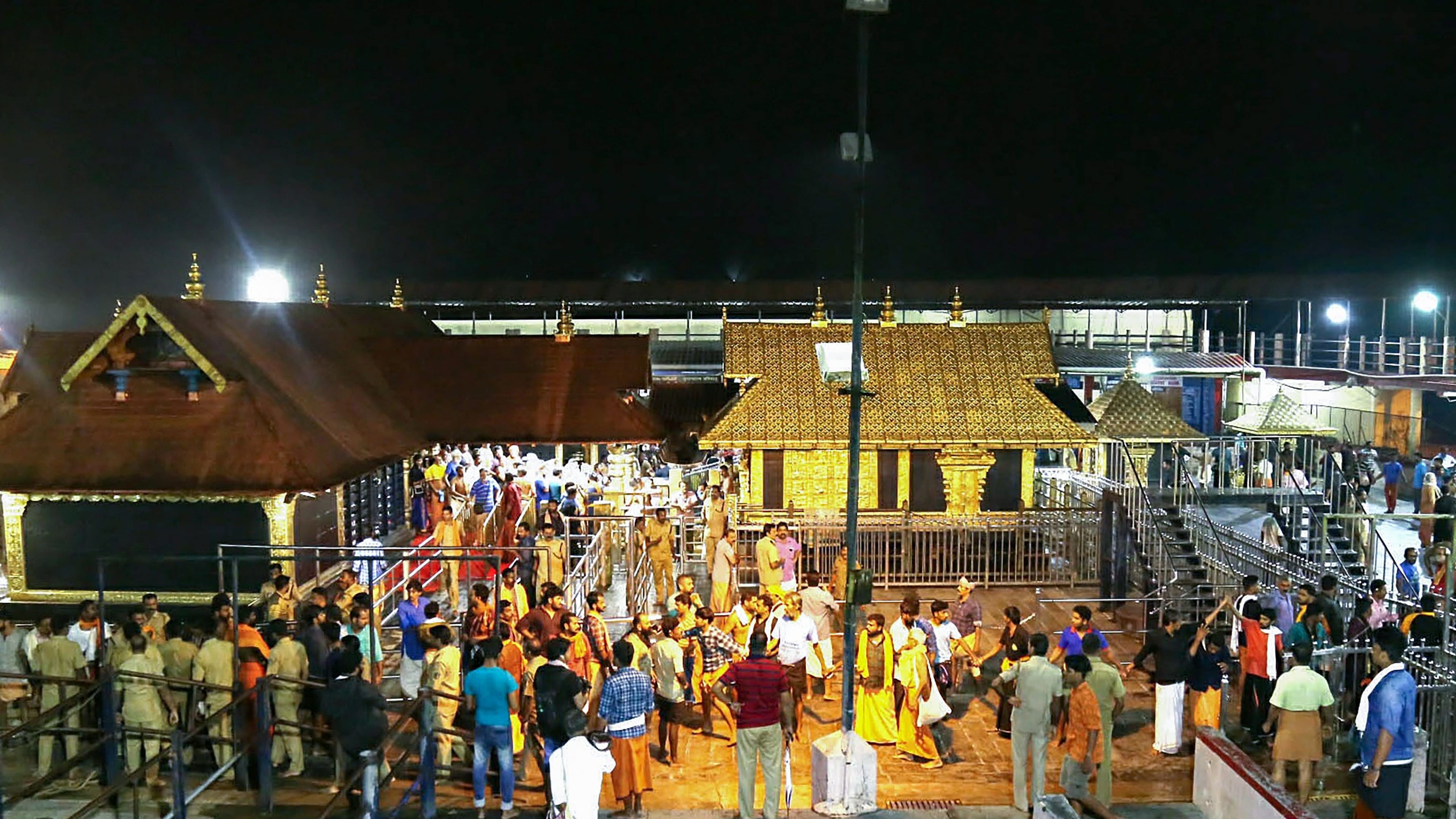 <div class="paragraphs"><p>Devotees at Sabarimala Temple.</p></div>