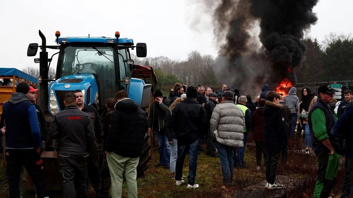 <div class="paragraphs"><p>French farmers block the N12 road with their tractors to protest over price pressures, taxes and green regulation, grievances shared by farmers across Europe, in Plouisy near Guingamp, Brittany, France, January 24, 2024. </p></div>