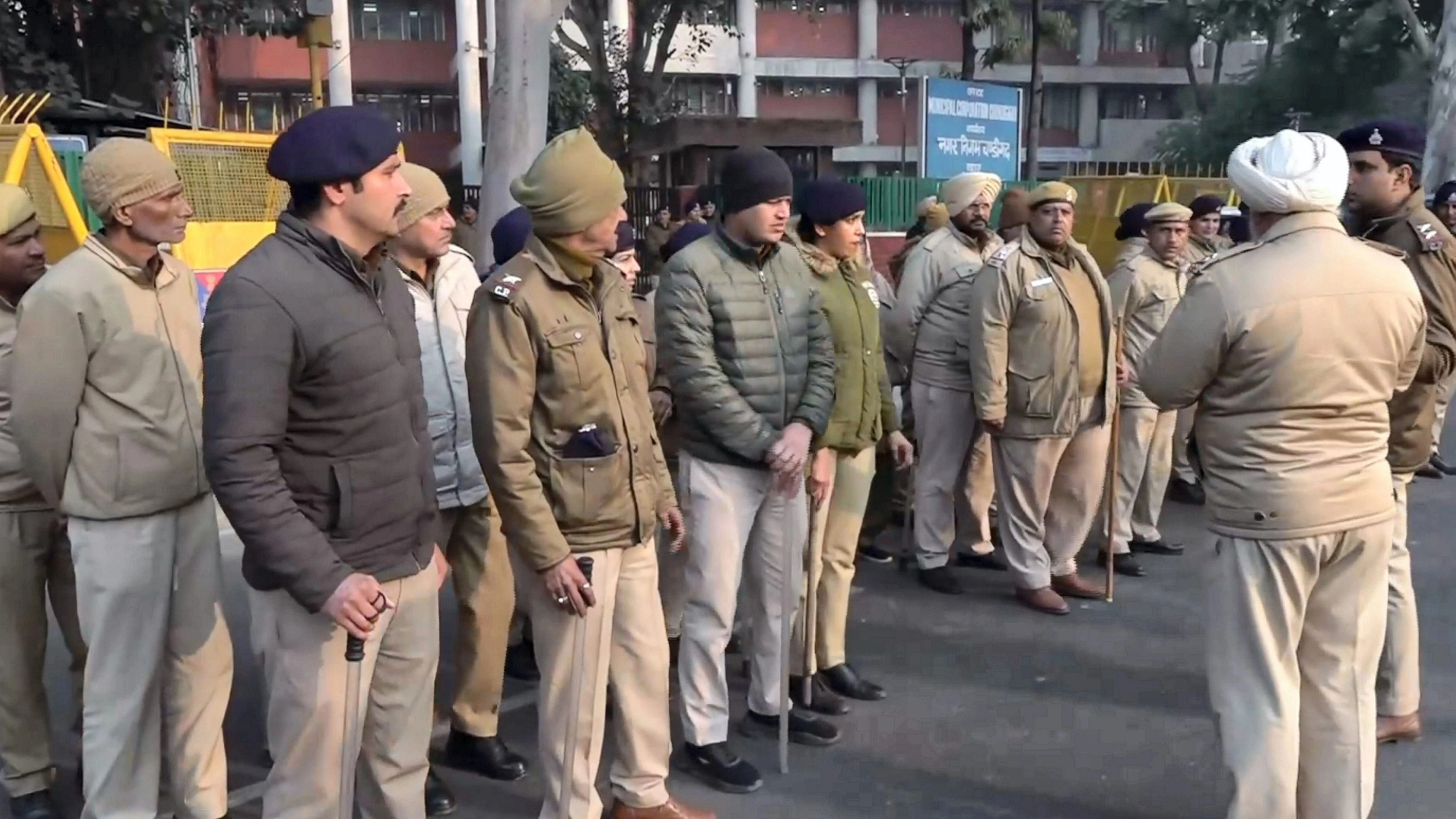 <div class="paragraphs"><p>Security personnel stand guard near the Chandigarh Municipal Corporation ahead of mayoral polls, in Chandigarh, Thursday, Jan. 18, 2024</p></div>