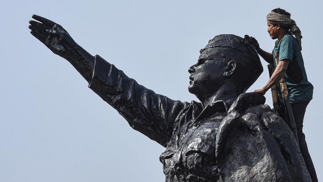 <div class="paragraphs"><p>A worker paints a statue of Netaji Subash Chandra Bose in Kolkata. </p></div>