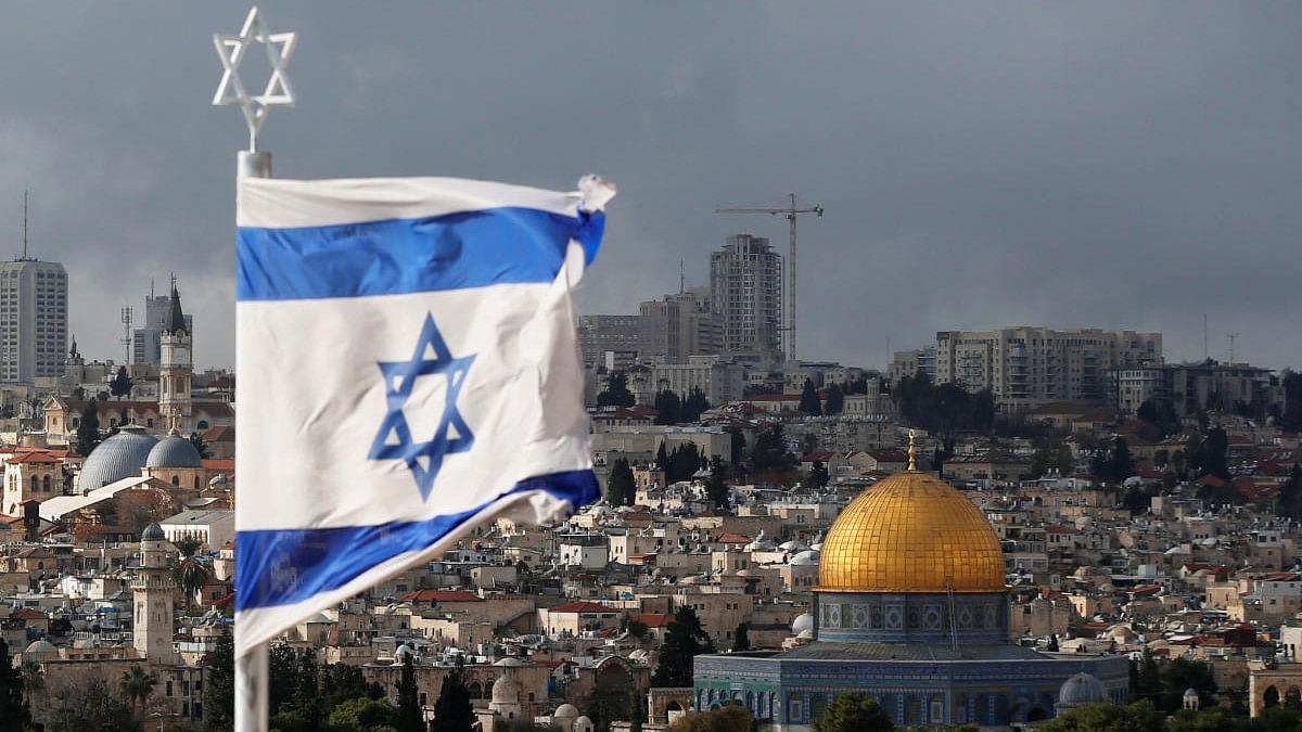 <div class="paragraphs"><p>An Israeli flag is seen near the Dome of the Rock, located in Jerusalem's Old City on the compound known to Muslims as Noble Sanctuary and to Jews as Temple Mount</p></div>