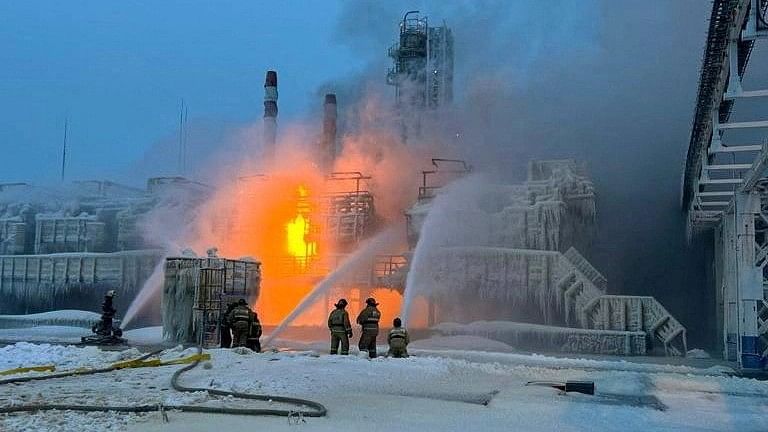 <div class="paragraphs"><p>Firefighters work to extinguish fire at the Novatek terminal in the port of Ust-Luga, Russia.</p></div>