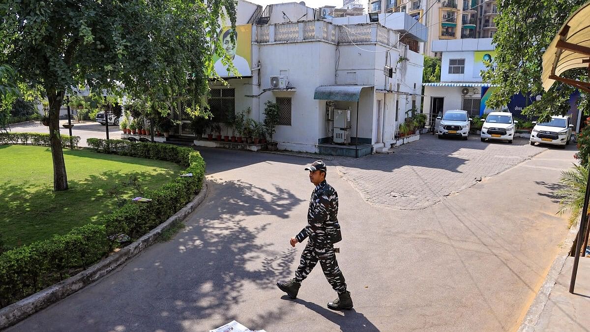 <div class="paragraphs"><p>File photo of a security official outside the residence of  Rajasthan Congress leader Govind Singh Dotasra during an ED raid as part of a money laundering investigation into the alleged exam paper leak case.&nbsp;</p></div>