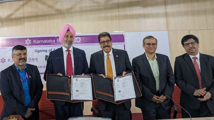 <div class="paragraphs"><p>Executives from Karnataka Bank and Satin CreditCare Network at the co-lending agreement signing on Friday in Bengaluru.&nbsp;</p></div>