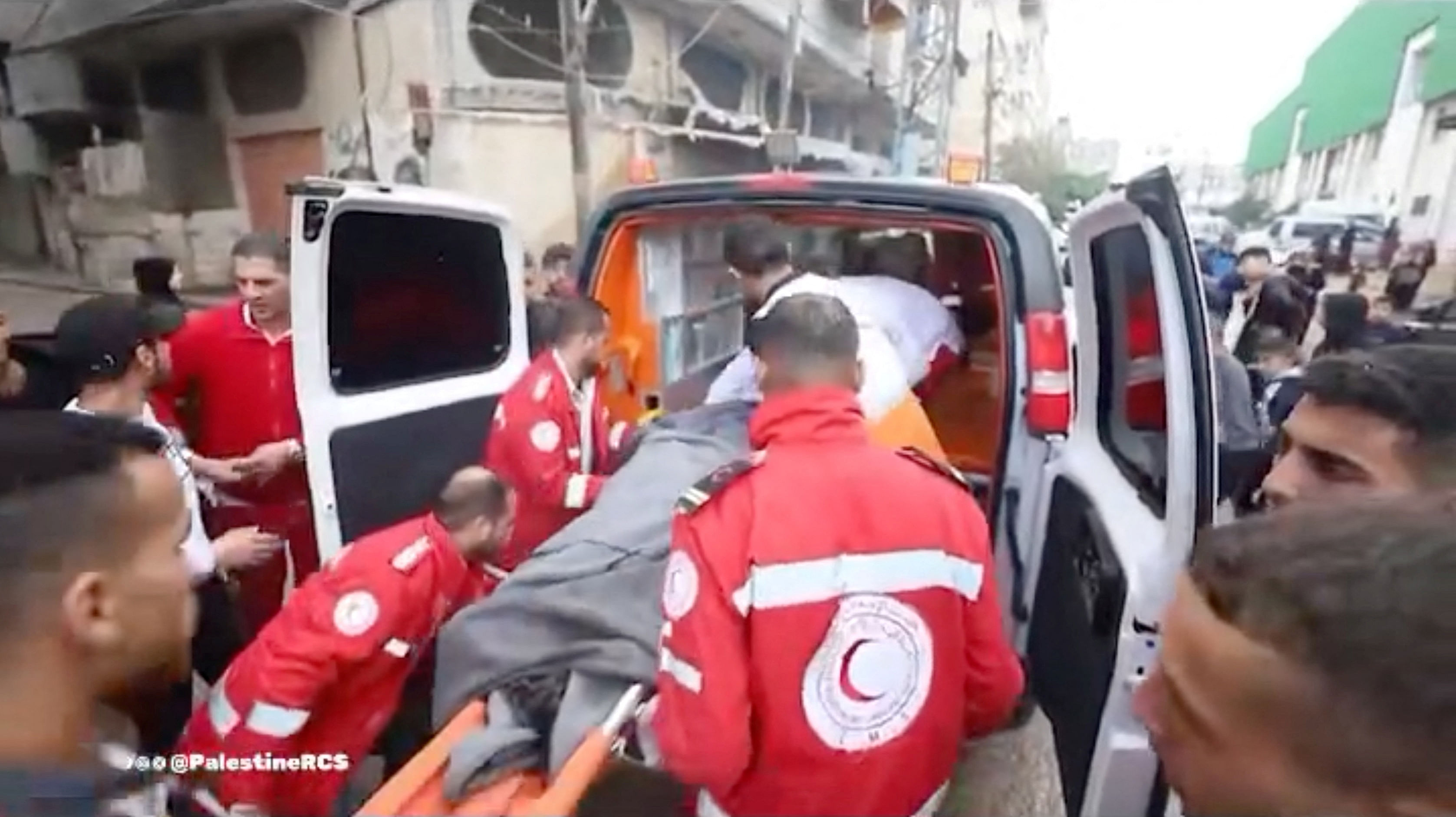 <div class="paragraphs"><p>Palestine Red Crescent Society  rescuers move a casualty into an ambulance following an attack, amid the ongoing conflict between Israel and the Palestinian Islamist group Hamas.</p></div>