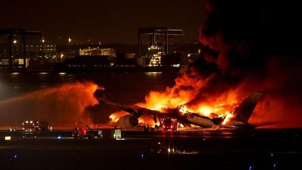 <div class="paragraphs"><p>Firefighters work at Haneda International Airport after Japan Airlines' A350 airplane caught on fire, in Tokyo, Japan.</p></div>