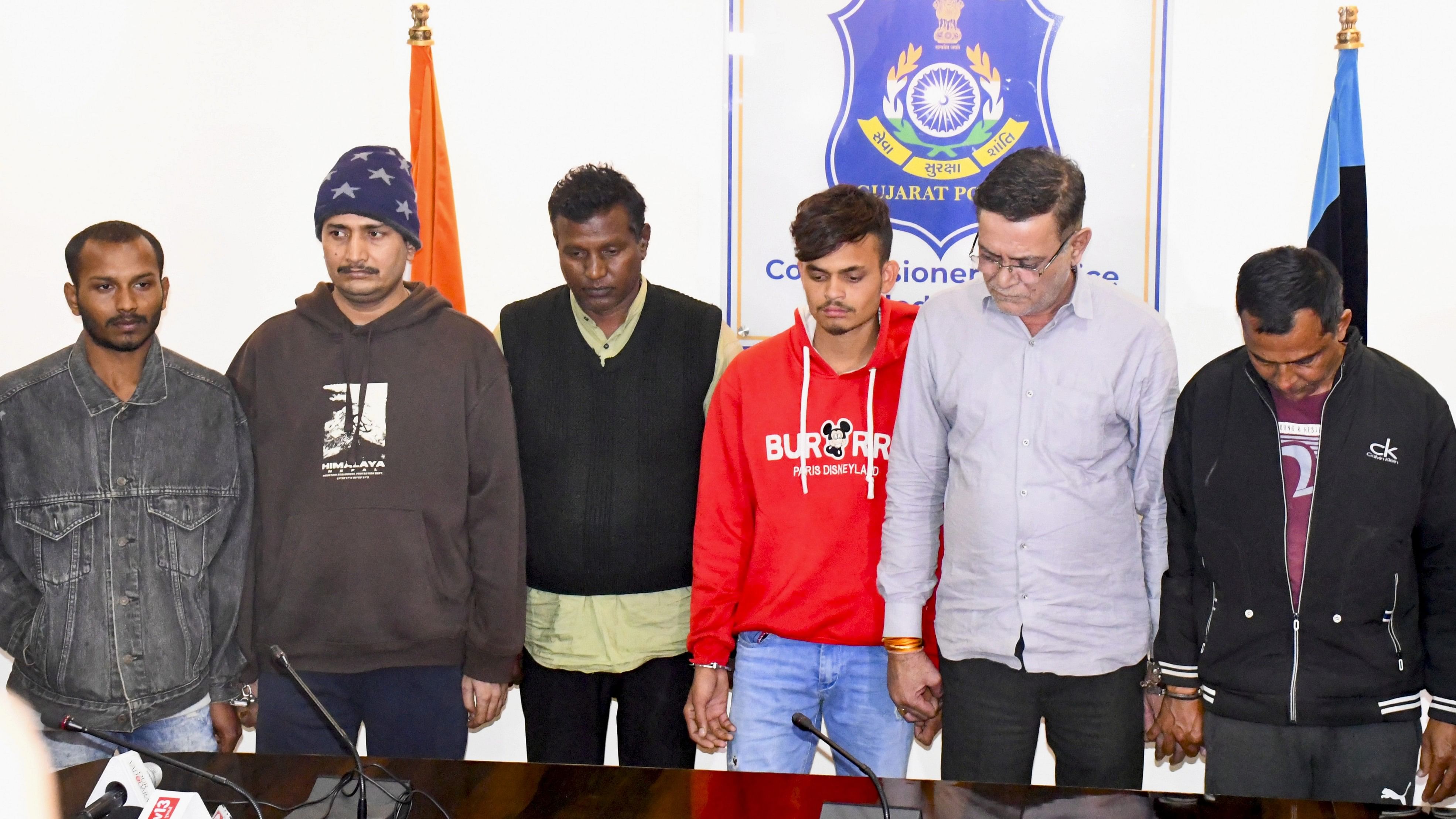 <div class="paragraphs"><p>Police personnel with the accused arrested in connection with the boat capsized case during a press conference, in Vadodara.&nbsp;</p></div>