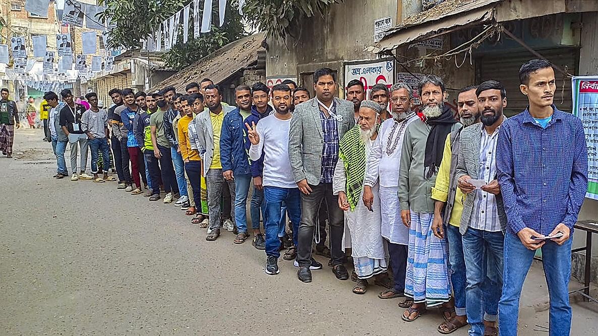 <div class="paragraphs"><p>Voters stand in a queue to cast their vote in the Bangladesh's general elections, at Camilla in Chittagong.</p></div>
