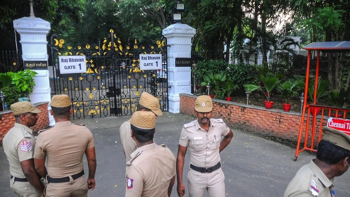 <div class="paragraphs"><p>Police outside Raj Bhavan after petrol bomb hurled.</p></div>