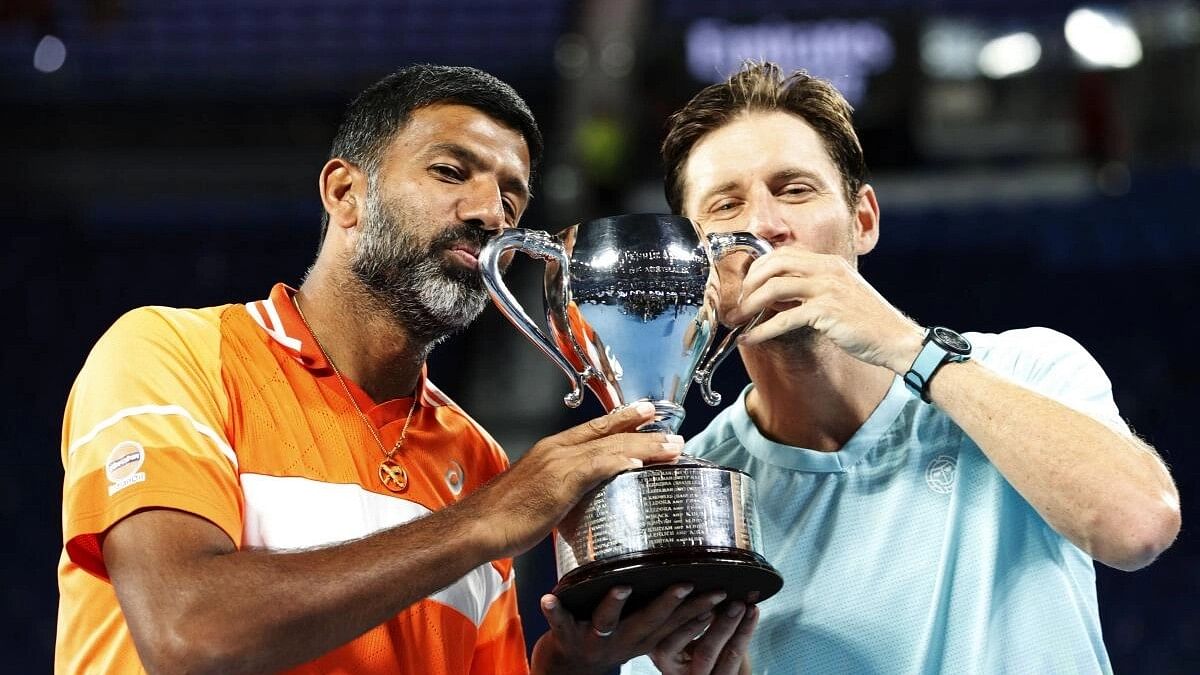 <div class="paragraphs"><p> India's Rohan Bopanna and Australia's Matthew Ebden celebrate with the trophy after winning the men's doubles final against Italy's Simone Bolelli and Andrea Vavassori</p></div>