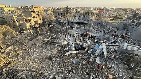 <div class="paragraphs"><p>Palestinians inspect the site of an Israeli strike on a mosque, amid the ongoing conflict between Israel and Hamas, in Rafah in the southern Gaza Strip.</p></div>