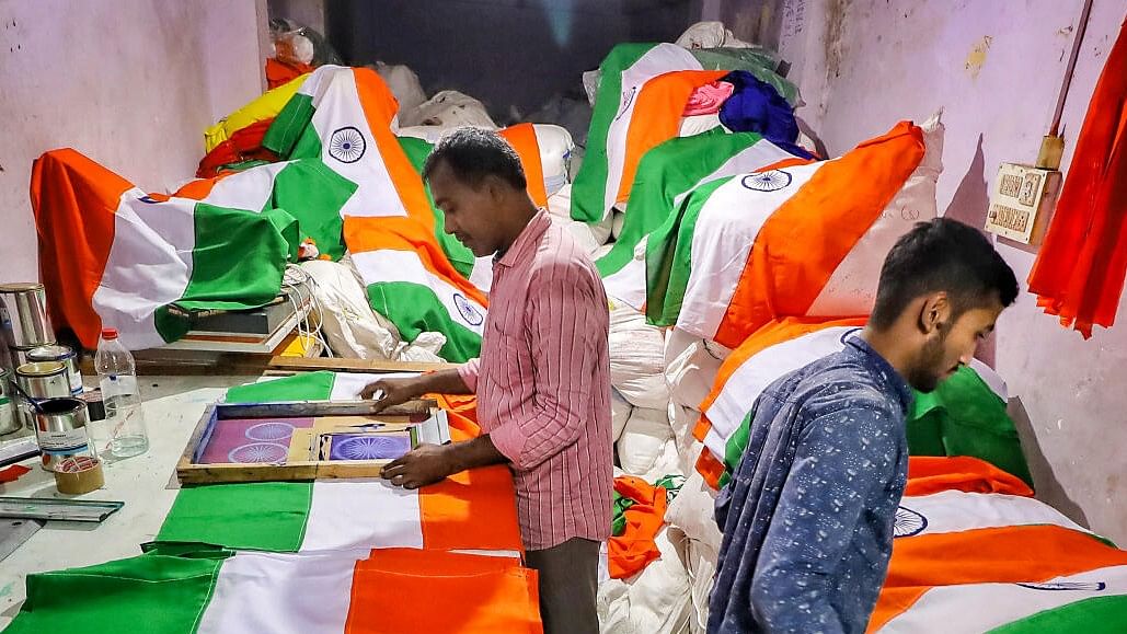 <div class="paragraphs"><p>Workers prepare tricolour flags ahead of Republic Day.&nbsp;</p></div>