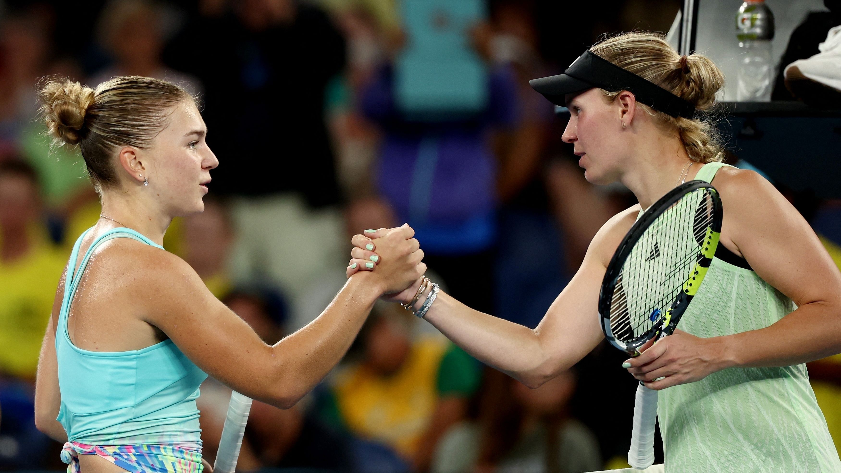 <div class="paragraphs"><p>(L) Russia's Maria Timofeeva shakes hands with (R) Denmark's Caroline Wozniacki after winning her second round match on January 17, 2024.</p></div>