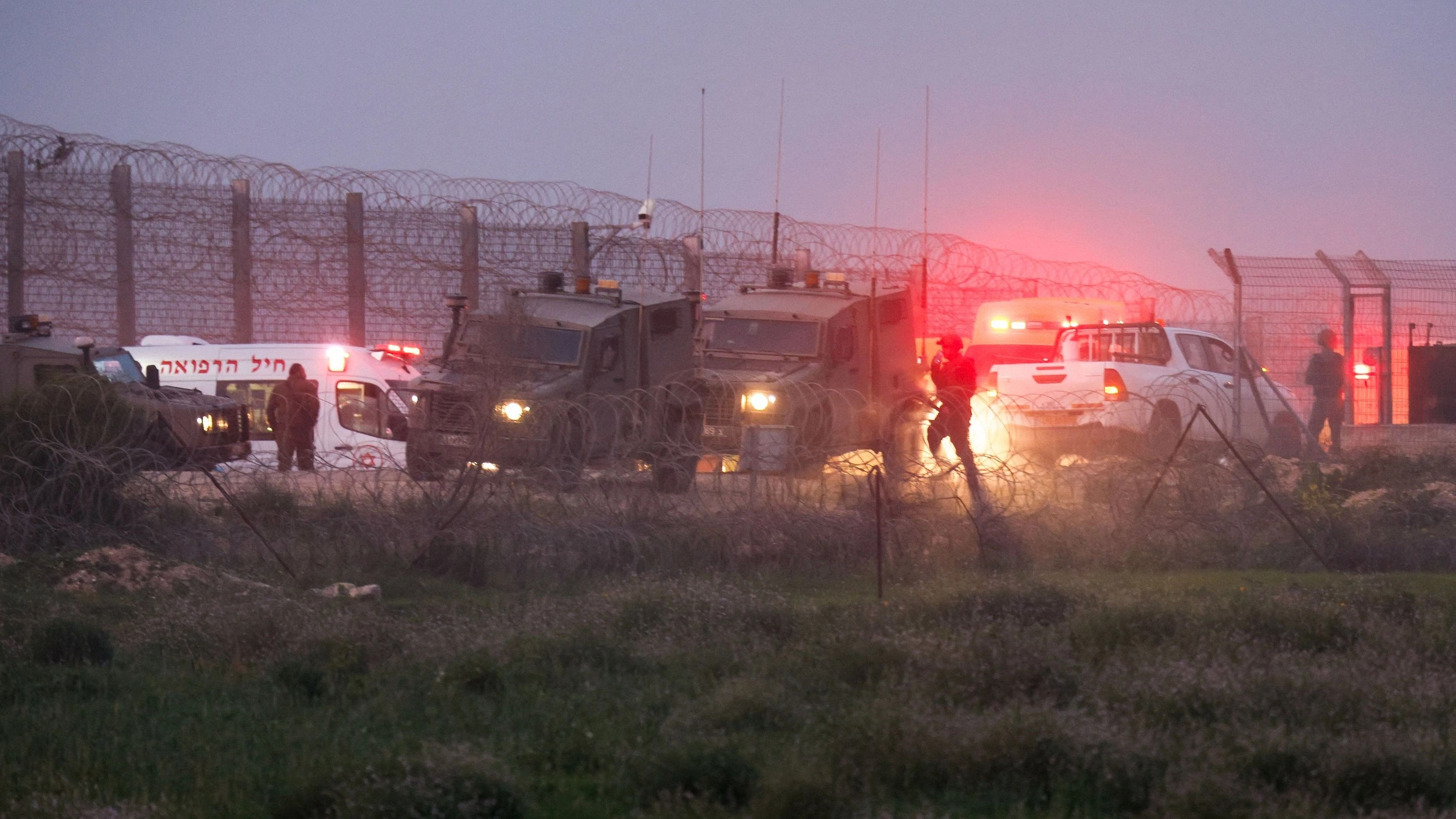 <div class="paragraphs"><p>Israeli soldiers walk next to military vehicles and ambulances, as the conflict continues between Israel and the Palestinian Islamist group Hamas, near the fence on the Israeli border with Gaza, Israel January 22, 2024. </p></div>