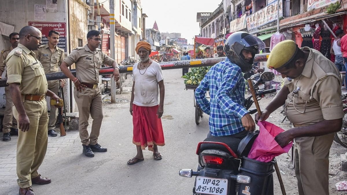 <div class="paragraphs"><p>Police check a motorist in Ayodhya. Representative image. </p></div>