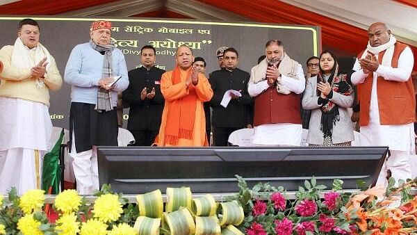 <div class="paragraphs"><p>Uttar Pradesh Chief Minister Yogi Adityanath during flagging off e-buses and e-autos for easy movement of devotees and common people ahead of the consecration ceremony of Ram Temple, in Ayodhya, Sunday, Jan. 14, 2024.</p></div>