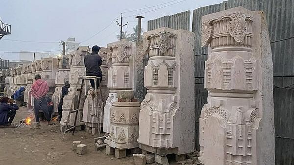 <div class="paragraphs"><p>Workers clean carved stones at Ram Janmabhoomi Nyas 'karyashala', in Ayodhya, on December 31, 2023</p></div>