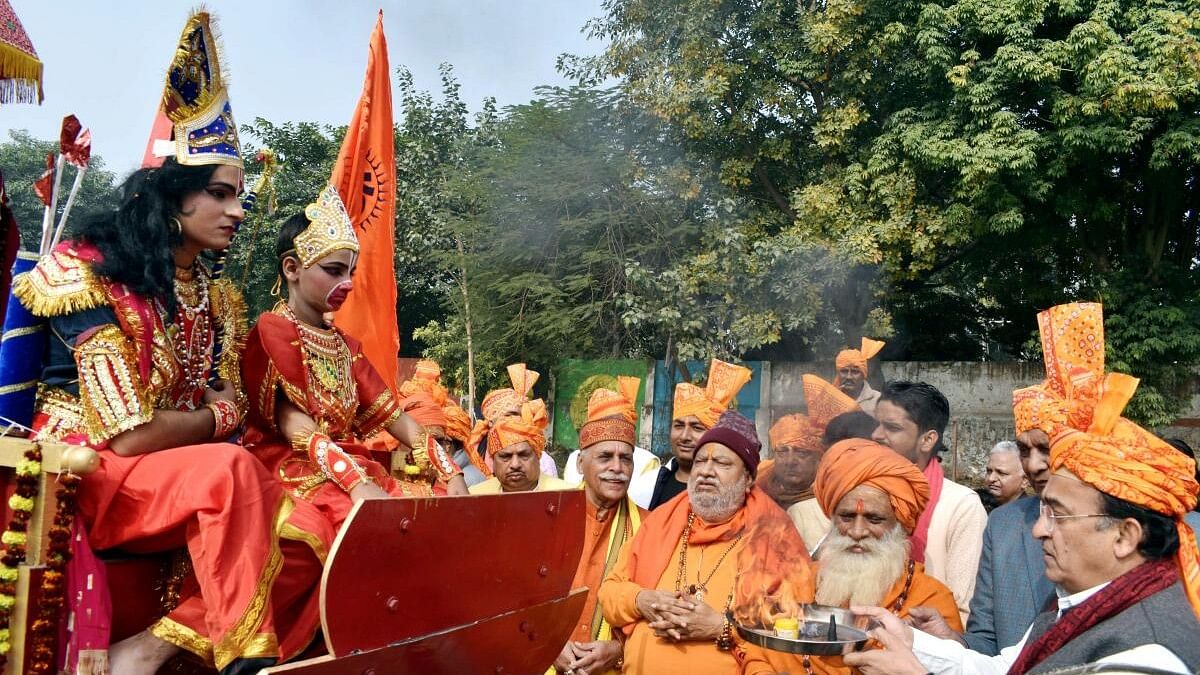 <div class="paragraphs"><p>RSS volunteers take part in 'Shri Ram Vijay Dhwaj Yarta' ahead of the inauguration of Ayodhya's Ram Mandir, in Prayagraj, Sunday, Dec. 31, 2023.</p></div>