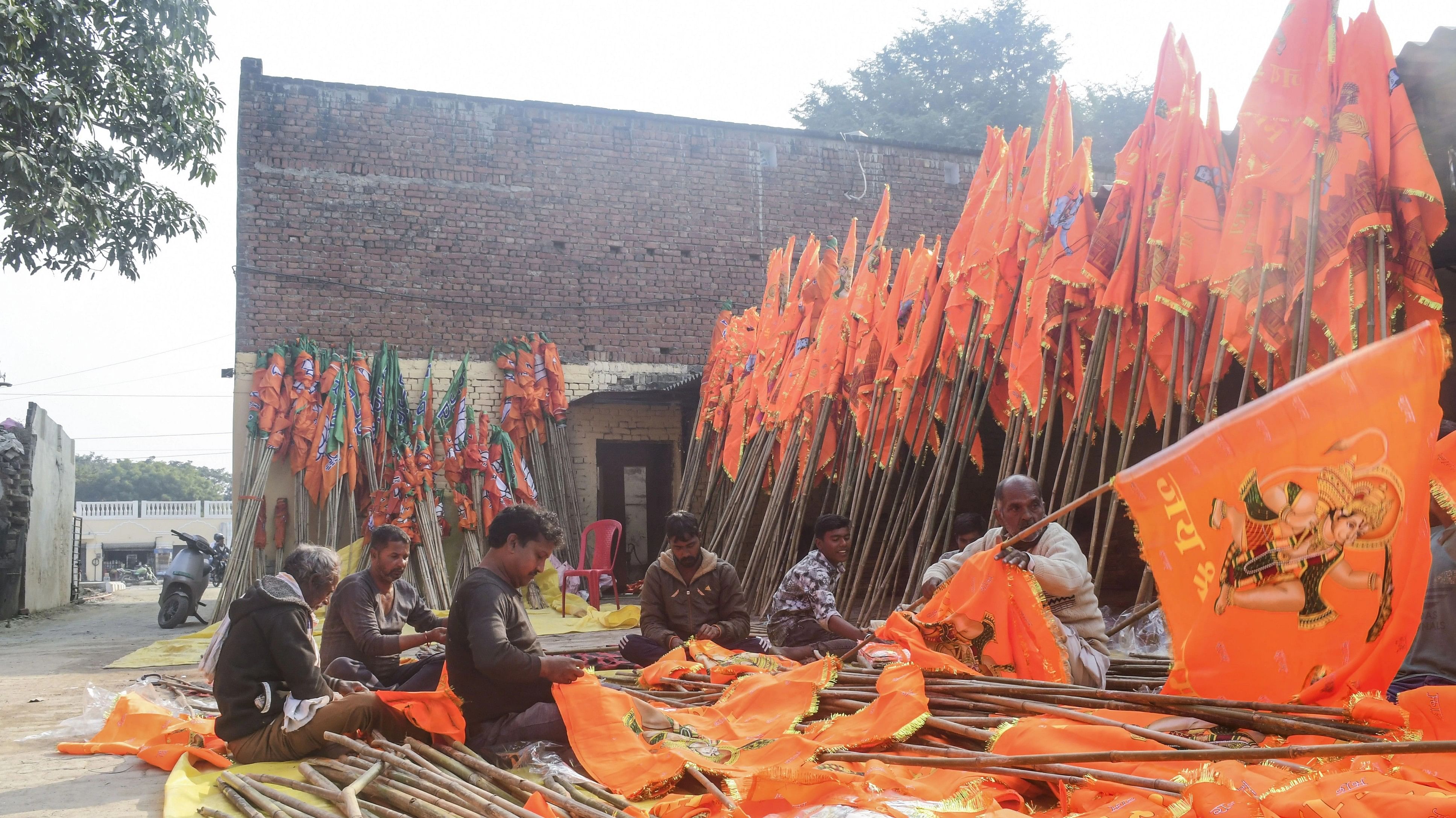 <div class="paragraphs"><p>Workers make flags of Lord Ram and Hanuman as part of preparations for the upcoming inauguration of Shri Ram Janmabhoomi temple, in Ayodhya, December 26, 2023. </p></div>