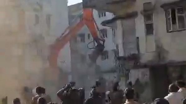 <div class="paragraphs"><p>Screengrab from a video showing demolition under way at the Air India Colony in Mumbai.</p></div>