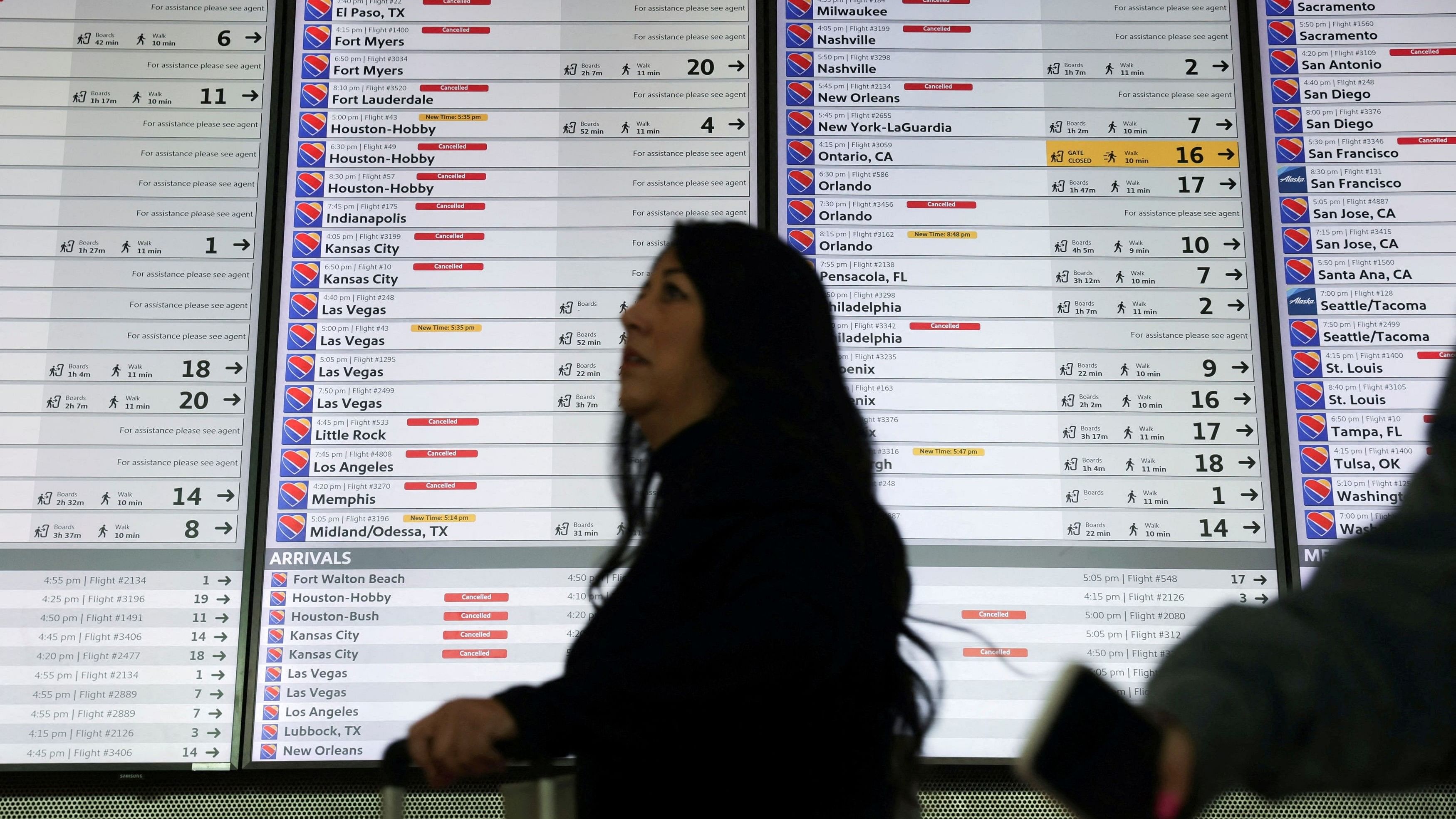 <div class="paragraphs"><p> The departures board is overwhelmed with delayed and cancelled flights after US airlines, led by Southwest, canceled thousands of flights due to a massive winter storm which swept over much of the country before and during the Christmas holiday weekend, at Dallas Love Field Airport in Dallas, Texas, U.S., December 28, 2022.  </p></div>