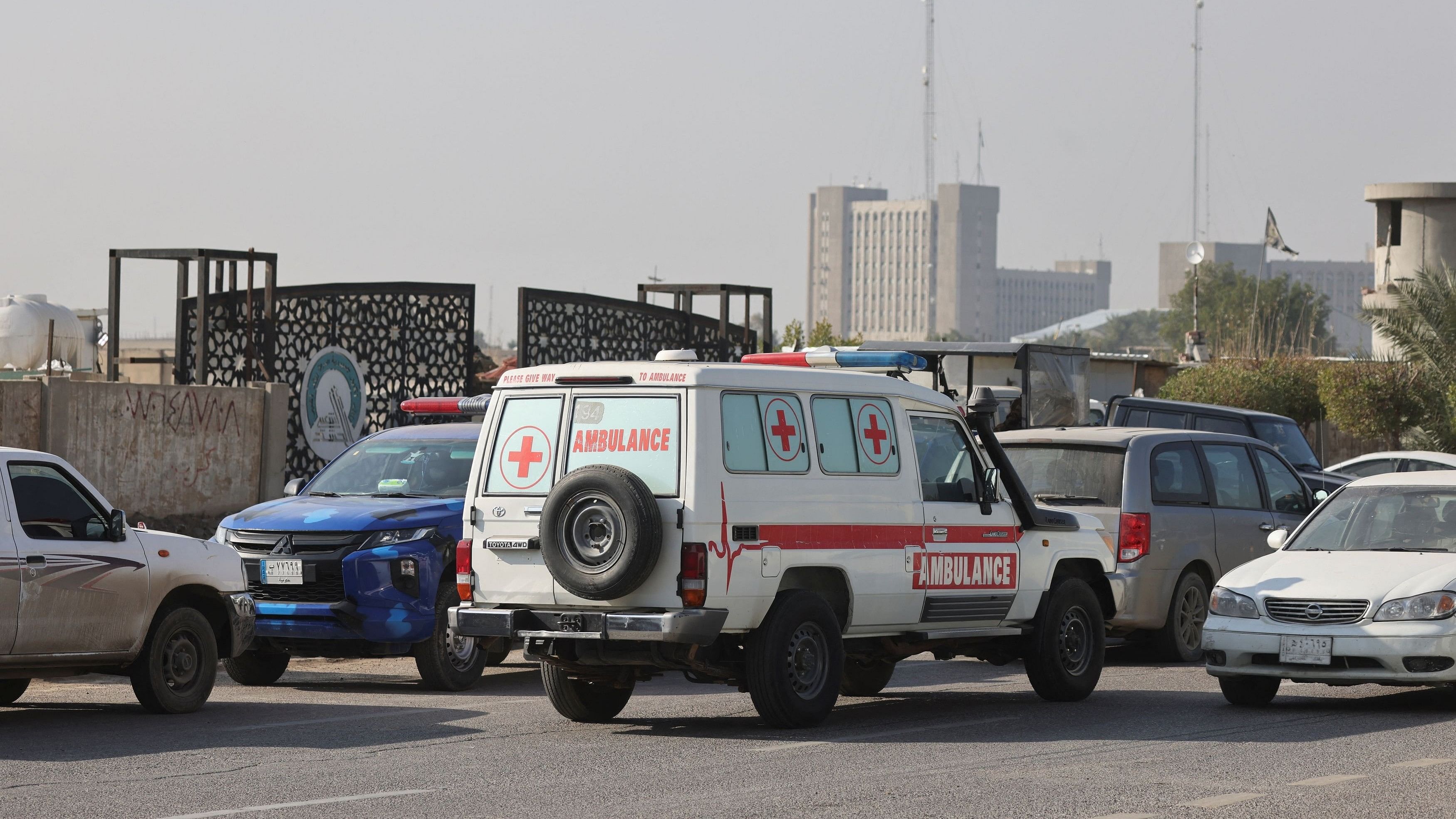 <div class="paragraphs"><p>Iraqi ambulance is parked next to a police vehicle at a street after an attack by a drone strike on an Iran-backed militia headquarters in Baghdad, Iraq January 4, 2024. </p></div>