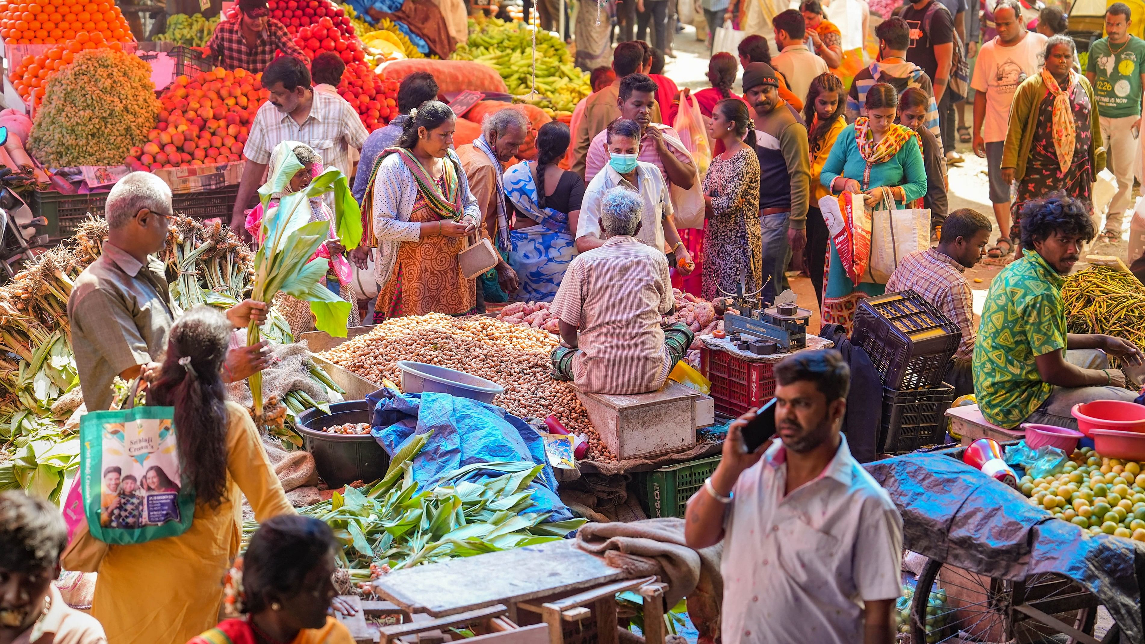 <div class="paragraphs"><p>Bengaluru: People buy vegetables and groundnuts ahead of the Makar Sankranti festival, at a wholesale market in Bengaluru, Sunday.</p></div>