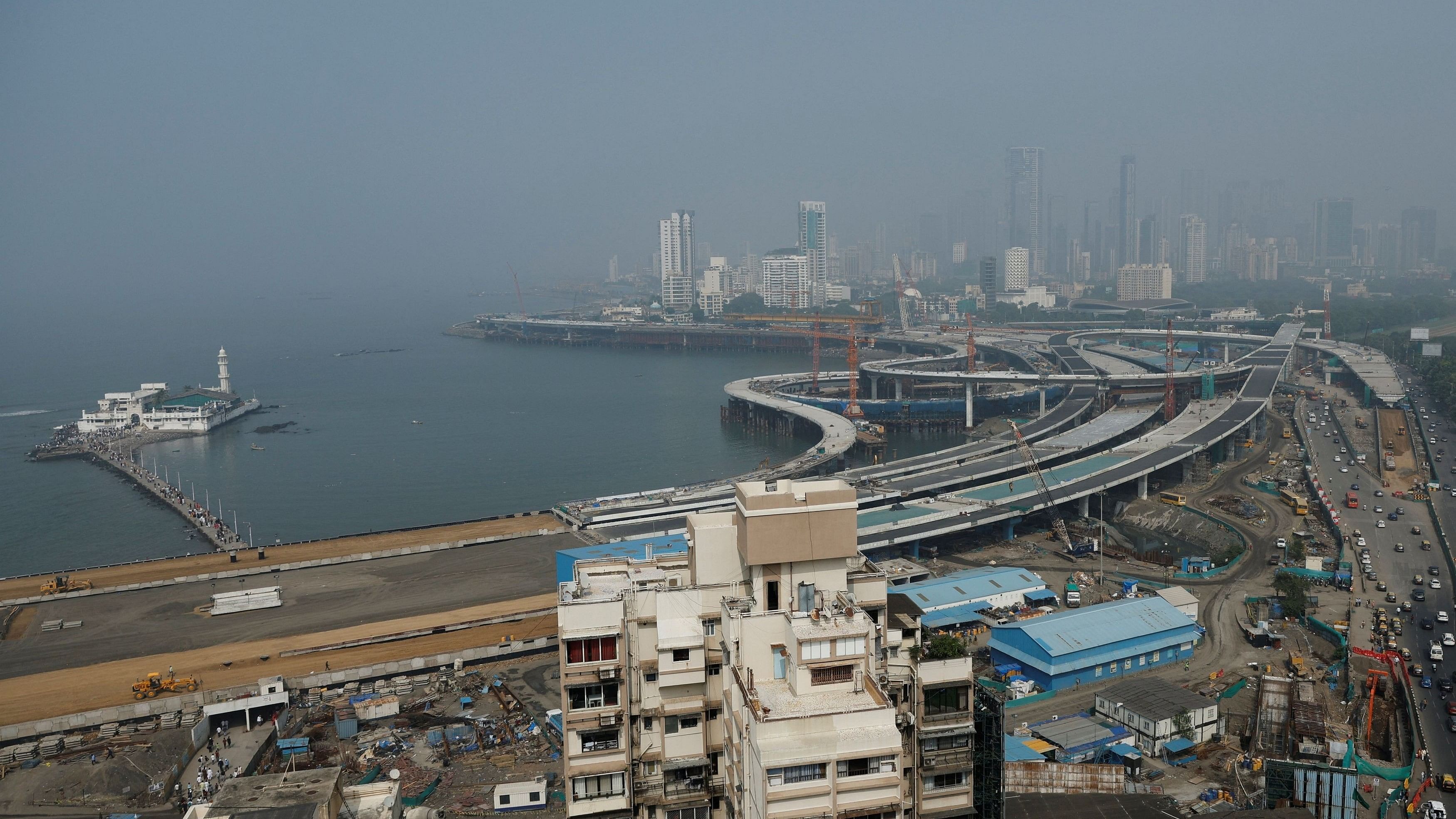 <div class="paragraphs"><p>A general view of residential buildings amidst the coastal road construction work in Mumbai, India, December 1, 2023.</p></div>