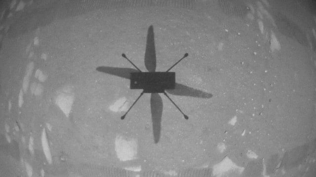 <div class="paragraphs"><p>The shadow of NASA's Mars helicopter Ingenuity is seen during its first flight on the planet April 19, 2021.</p></div>