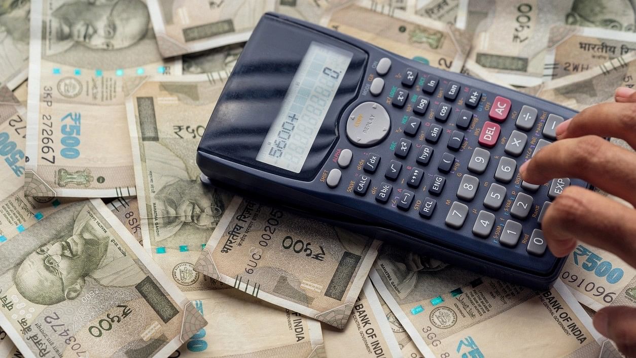 <div class="paragraphs"><p>Representative image showing Rs 500 notes and a calculator.</p></div>