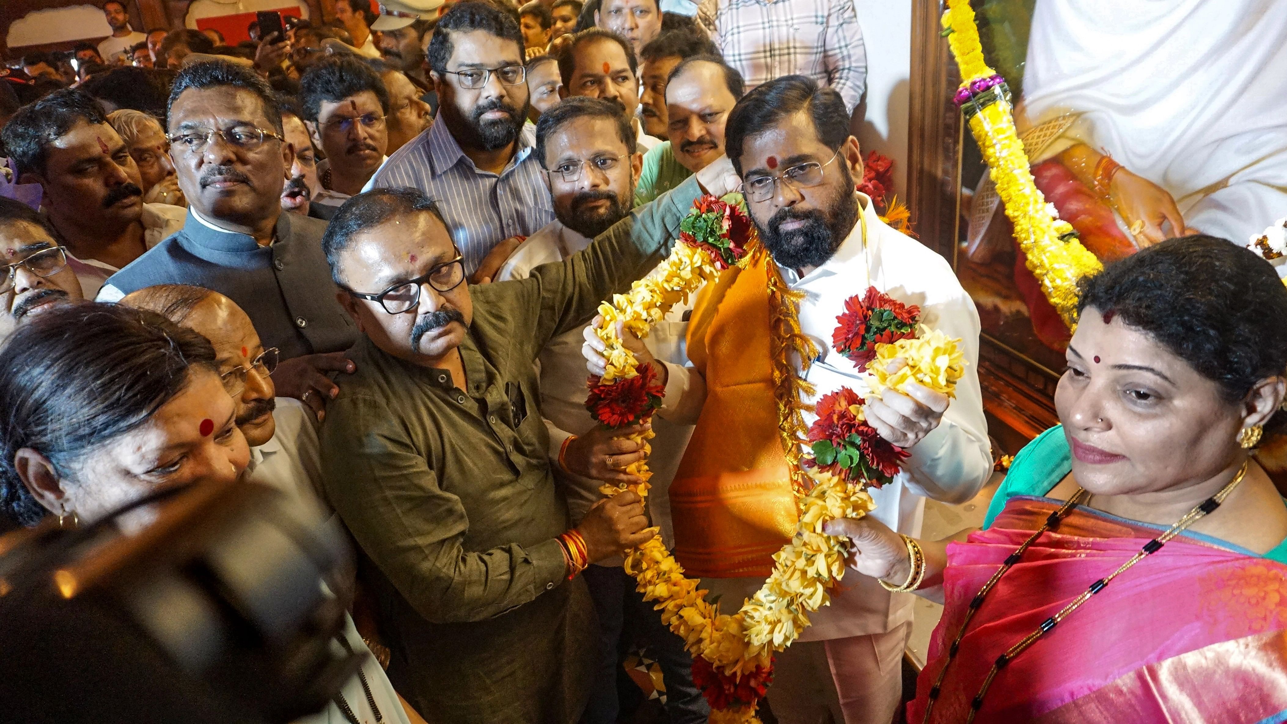 <div class="paragraphs"><p>Maharashtra Chief Minister Eknath Shinde with supporters during celebrations of Shiv Sena MLA disqualification case verdict, in Thane, on January 11, 2024 after Maharashtra Assembly Speaker Rahul Narwekar held that the Shiv Sena faction led by Shinde was the 'real political party' when rival groups emerged in June 2022, and did not disqualify any MLA from the two camps.</p></div>