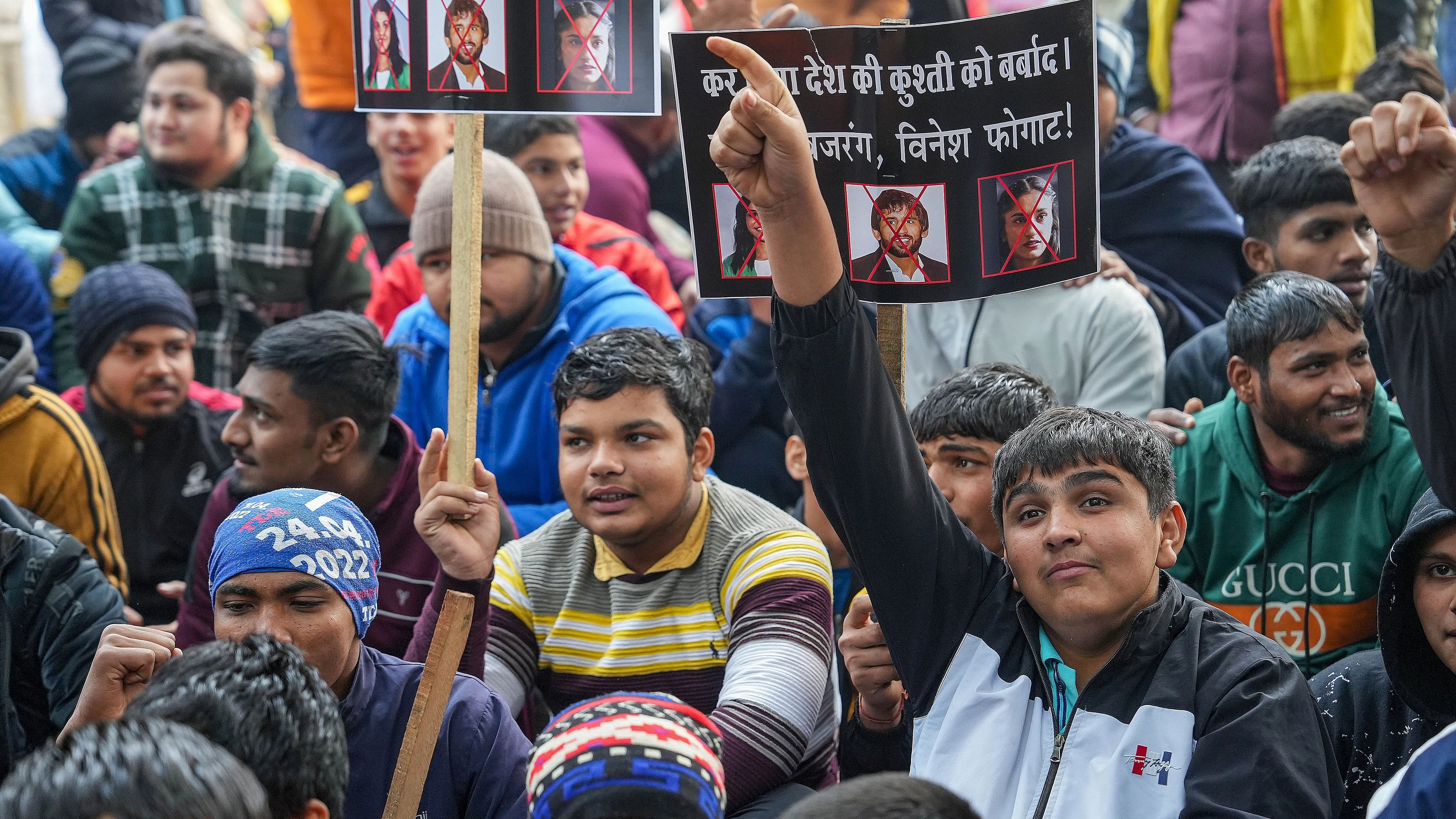 <div class="paragraphs"><p>New Delhi: Young wrestlers hold placards during a protest against wrestlers Sakshi Malik, Bajrang Punia and Vinesh Phogat at Jantar Mantar, in New Delhi, Wednesday, Jan. 3, 2024. </p></div>