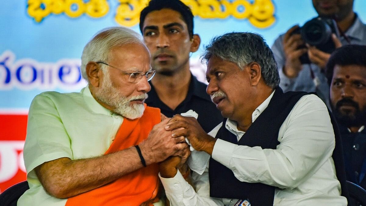 <div class="paragraphs"><p>Prime Minister Narendra Modi consoles Madiga Reservation Porata Samithi chief Manda Krishna Madiga. </p></div>