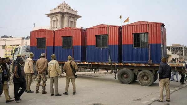 <div class="paragraphs"><p>Police personnel stand guard ahead of the consecration ceremony of Shri Ram Janmabhoomi Temple, in Ayodhya, Wednesday, Jan. 17, 2024.</p></div>