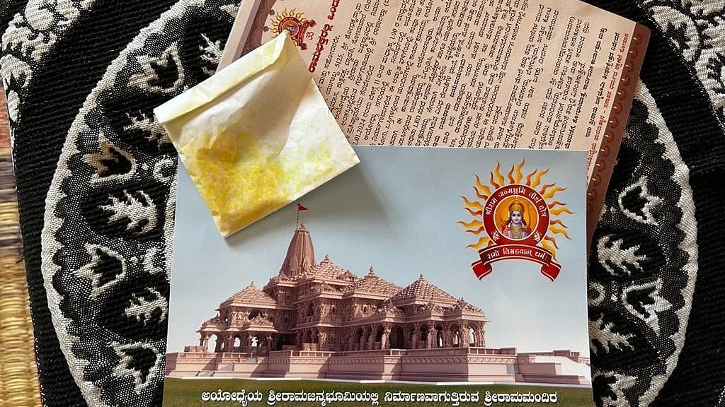<div class="paragraphs"><p>Akshat (holy rice) and the invitation card being offered by the saffron clad individuals in South Bengaluru</p></div>
