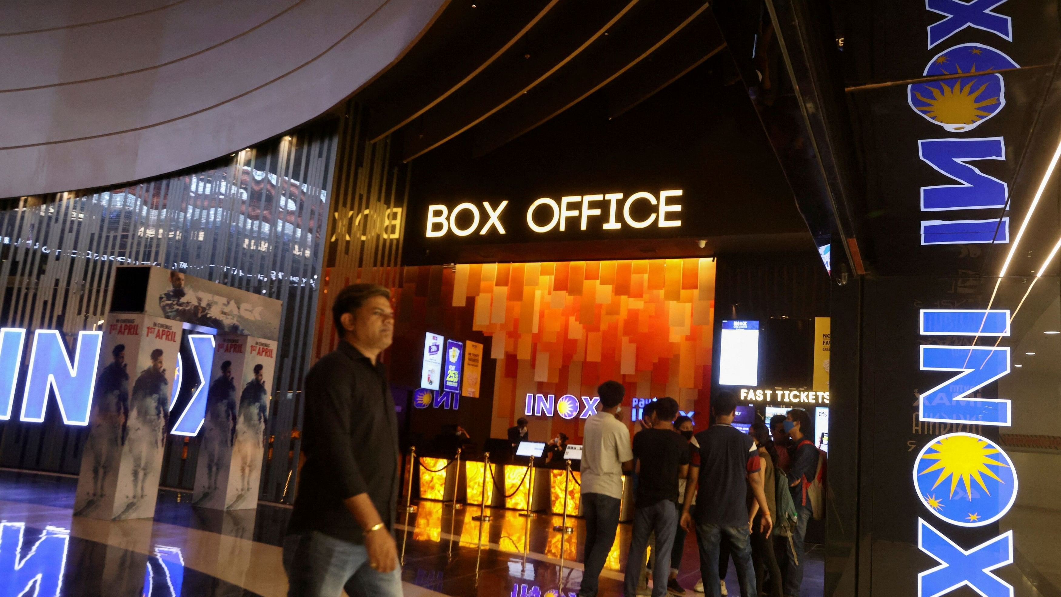 <div class="paragraphs"><p>People visit an INOX movie theatre in Mumbai.</p></div>