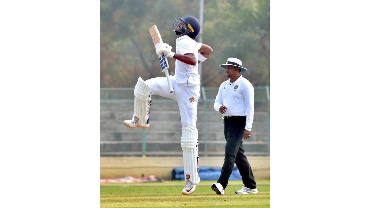 <div class="paragraphs"><p>Devdutt Padikkal jumps in joy after reaching his ton on the second day of their Ranji Trophy match in Hubballi on Saturday. </p></div>