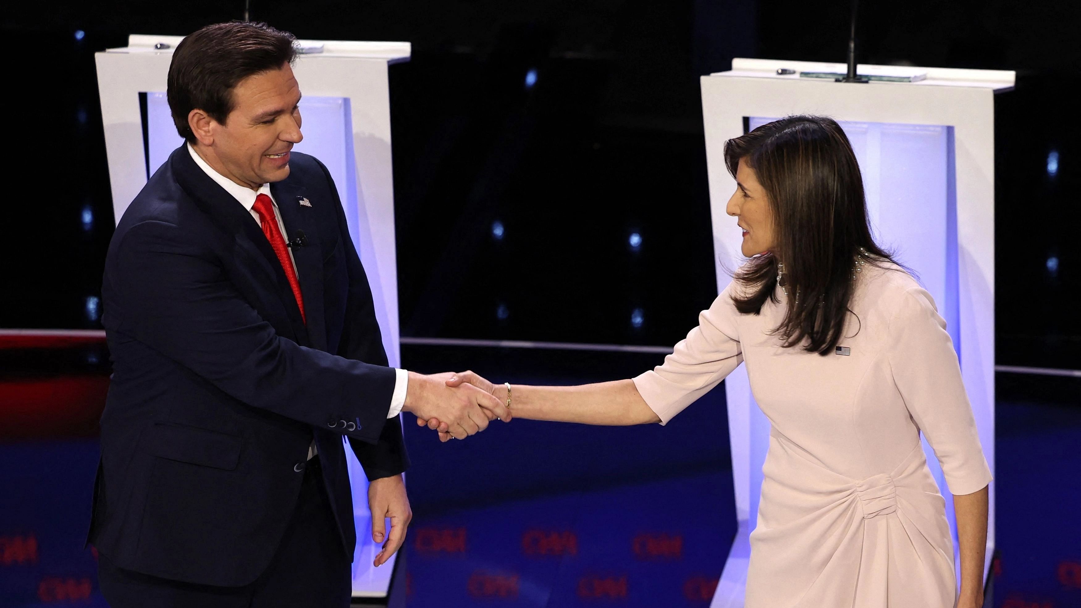 Florida Governor Ron DeSantis and Former U.S. Ambassador to the United Nations Nikki Haley shake hands before participating in the Republican candidates' presidential debate hosted by CNN at Drake University in Des Moines, Iowa, U.S. January 10, 2024. REUTERS/Mike Segar