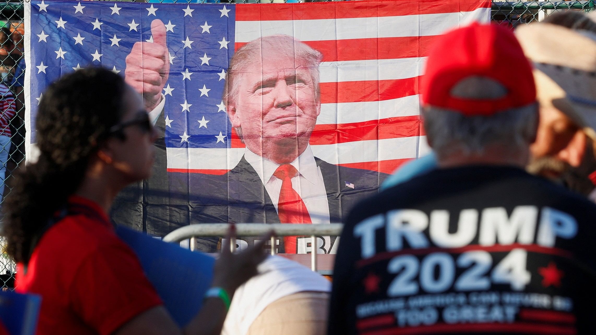 <div class="paragraphs"><p>A view of a U.S. flag with an image of Republican presidential candidate and former U.S. President Donald Trump on it at the Ted Hendricks Stadium ahead of Trump's campaign event in Hialeah, Florida, US </p></div>
