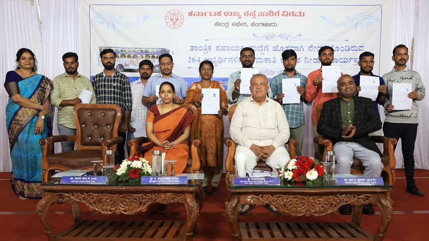 <div class="paragraphs"><p>Transport Minister Ramalinga Reddy and KSRTC Managing Director V Anbukumar with newly recruited technical assistants on Wednesday.</p></div>