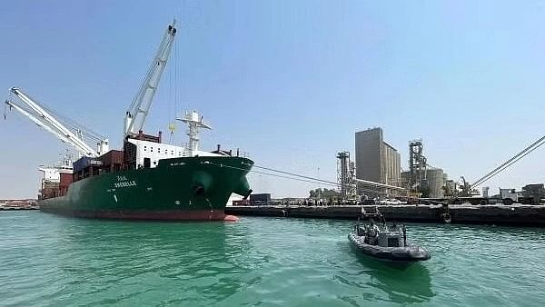 <div class="paragraphs"><p>A coastguard boat sails past a commercial container ship docked at the Houthi-held Red Sea port of Hodeidah, carrying general commercial goods.</p></div>
