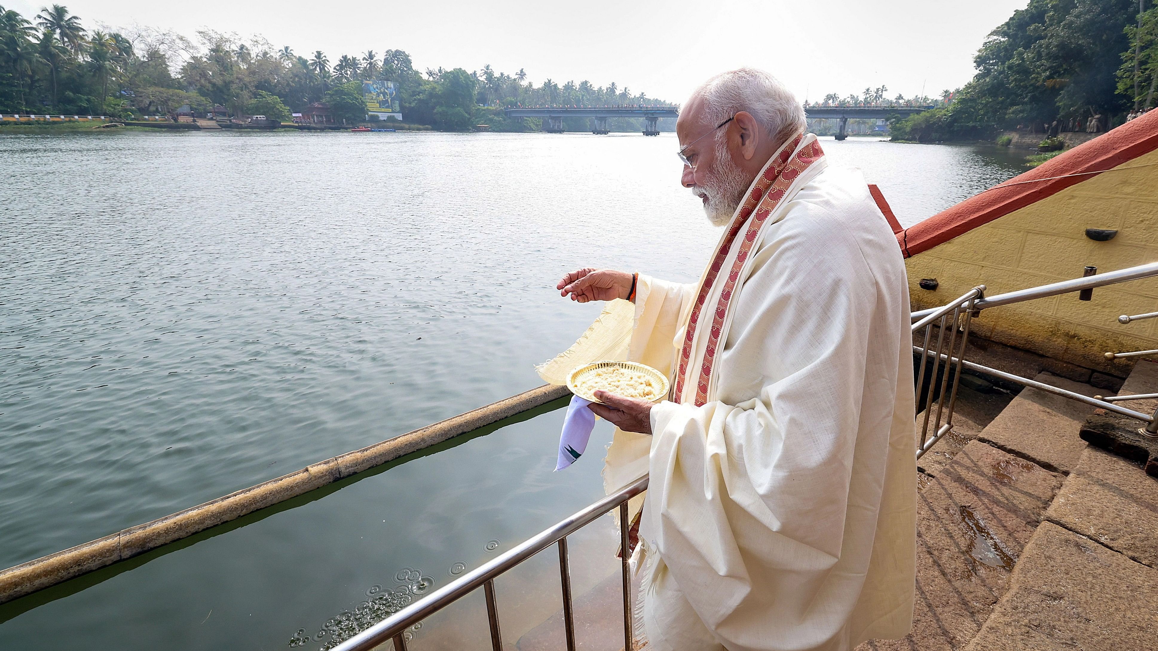 <div class="paragraphs"><p>Prime Minister Narendra Modi feeds fish during a visit to Triprayar Sree Ramaswamy Temple, in Thrissur district, Kerala, Wednesday, Jan. 17, 2024. </p></div>