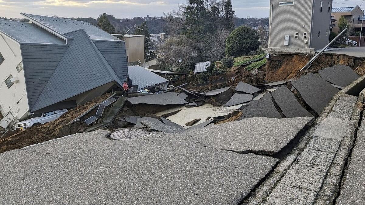 <div class="paragraphs"><p>A view of a collapsed road and houses because of an earthquake in Wajima, Ishikawa prefecture, Japan January 1, 2024, in this photo released by Kyodo.</p></div>