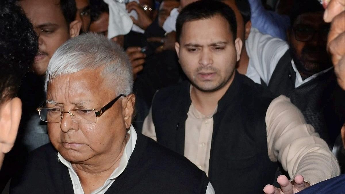 <div class="paragraphs"><p>ED asks RJD chief Lalu Prasad and his son and Bihar deputy chief minister Tejashwi Yadav to appear for questioning again.&nbsp;</p></div>