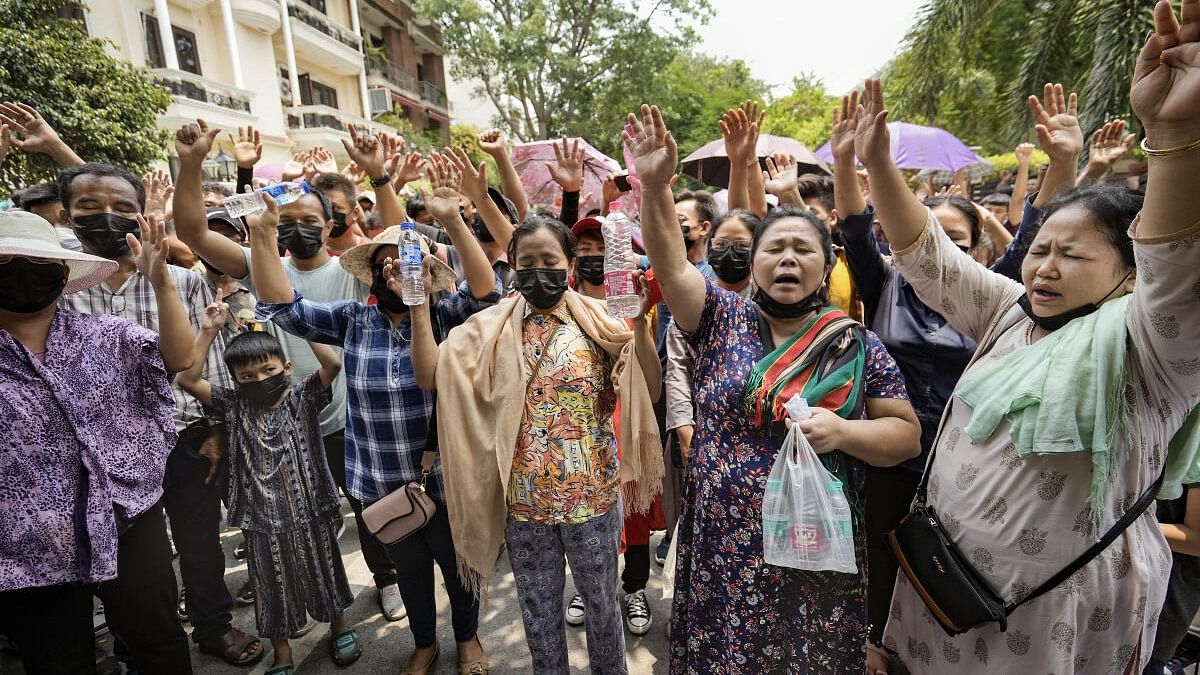 <div class="paragraphs"><p>In this file picture,&nbsp;people from Myanmar shout slogans during a rally organised by Myanmar Refugee Demand Committee.&nbsp;</p></div>