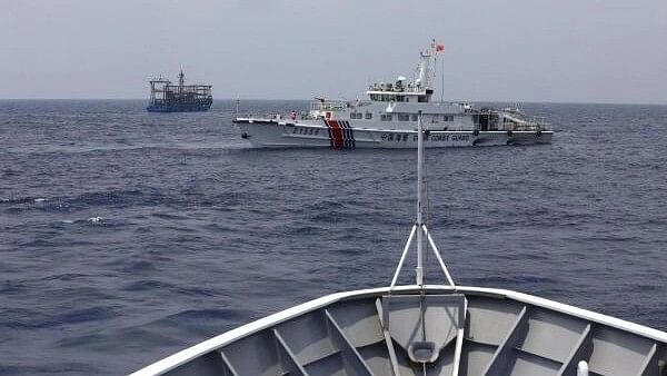 <div class="paragraphs"><p>A Chinese Coast Guard ship is seen blocking the direction of a Philippine Coast Guard ship conducting a resupply mission for Filipino troops stationed at a grounded warship in the South China Sea.</p></div>