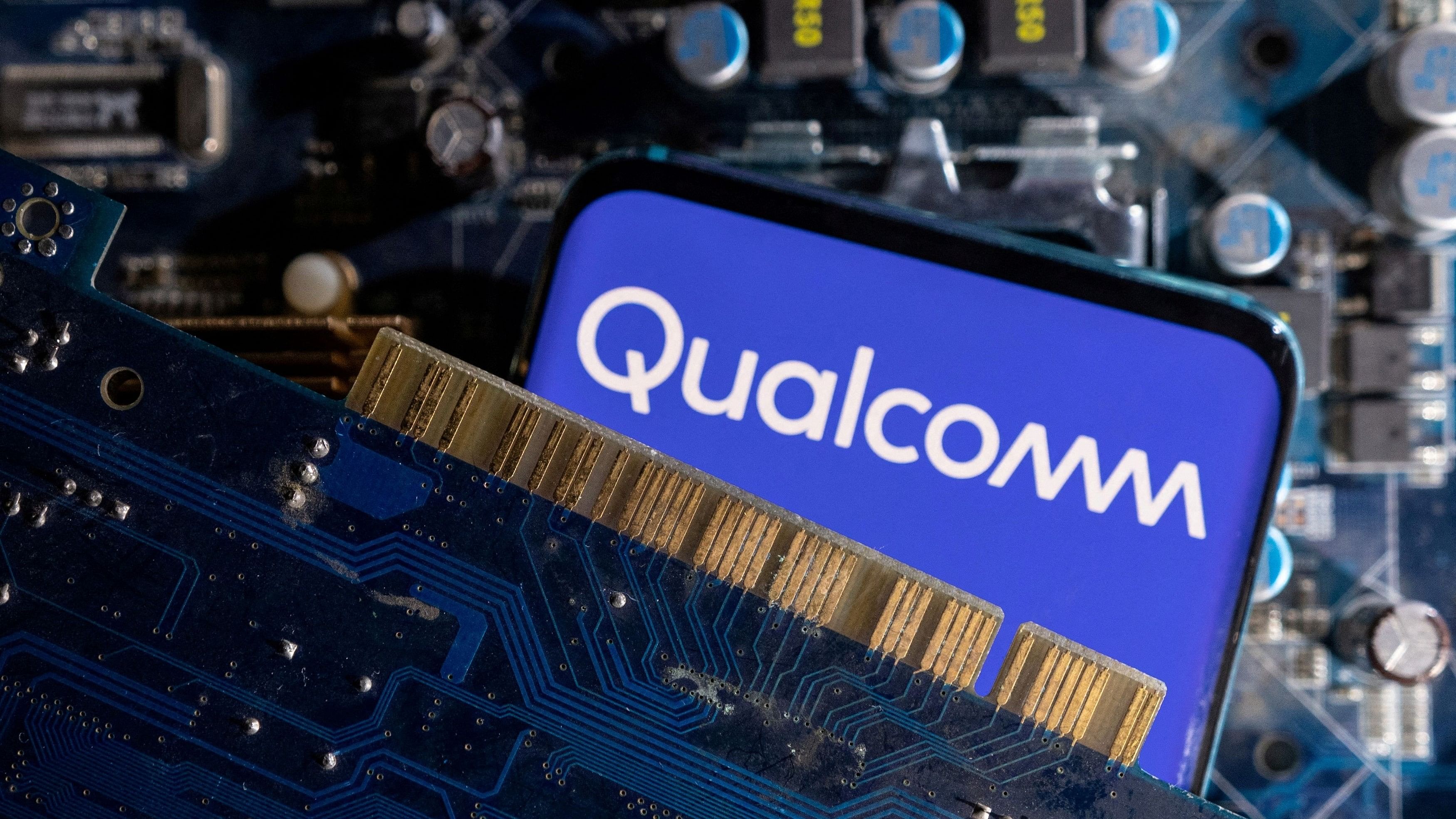 <div class="paragraphs"><p>A smartphone with a displayed Qualcomm logo is placed on a computer motherboard in this illustration taken March 6, 2023.</p></div>