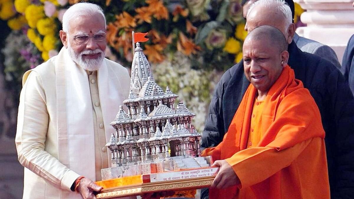 <div class="paragraphs"><p>Narendra Modi and Yogi Adityanath with a replica of the Ram mandir on the day of the consecration.</p></div>