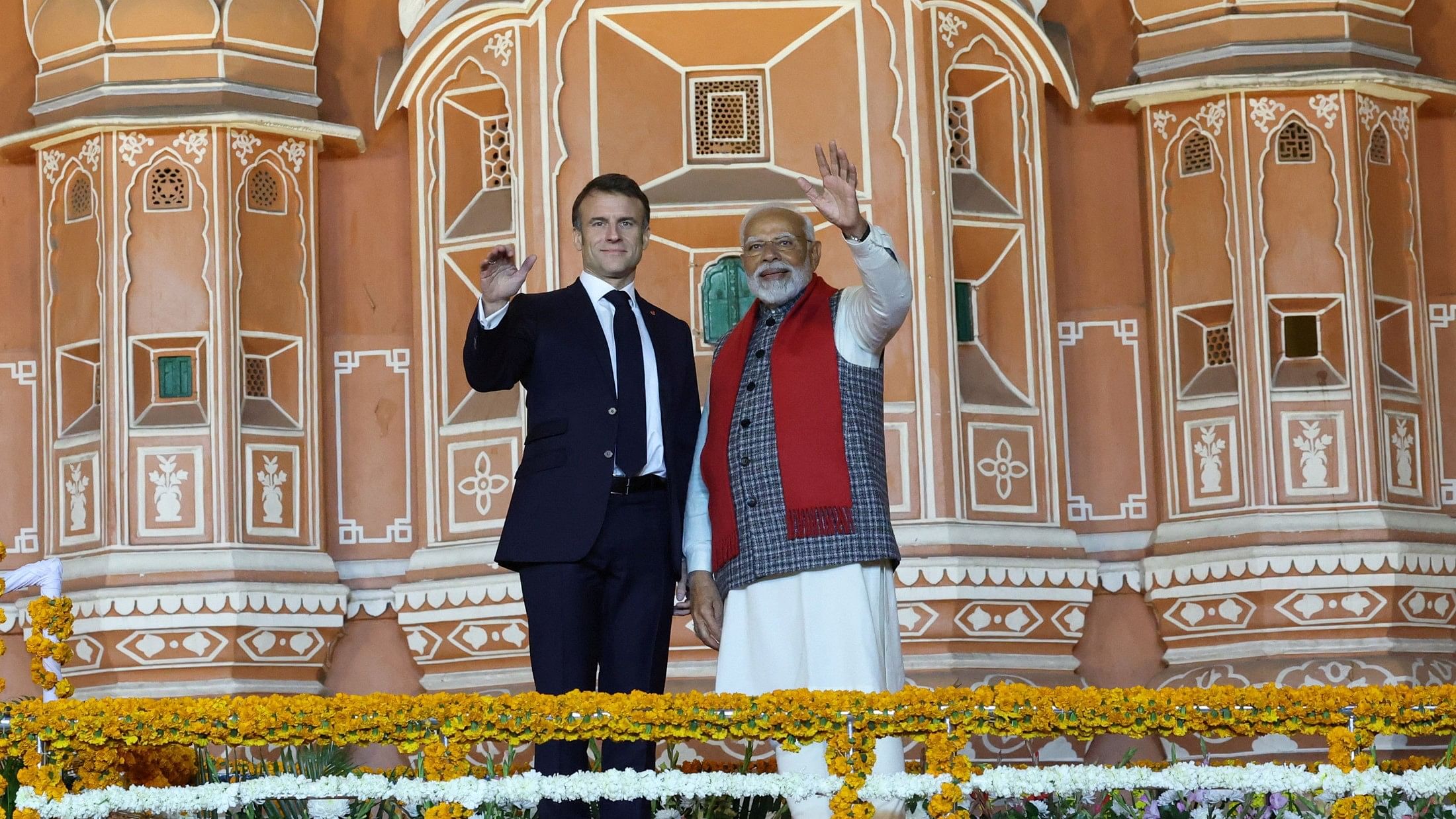 <div class="paragraphs"><p>Prime Minister Narendra Modi and French President Emmanuel Macron wave during a roadshow in Jaipur, India, January 25, 2024. <br></p></div>